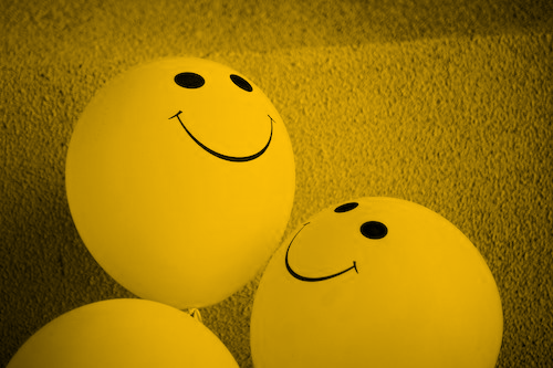 Optimism, smiling balloons